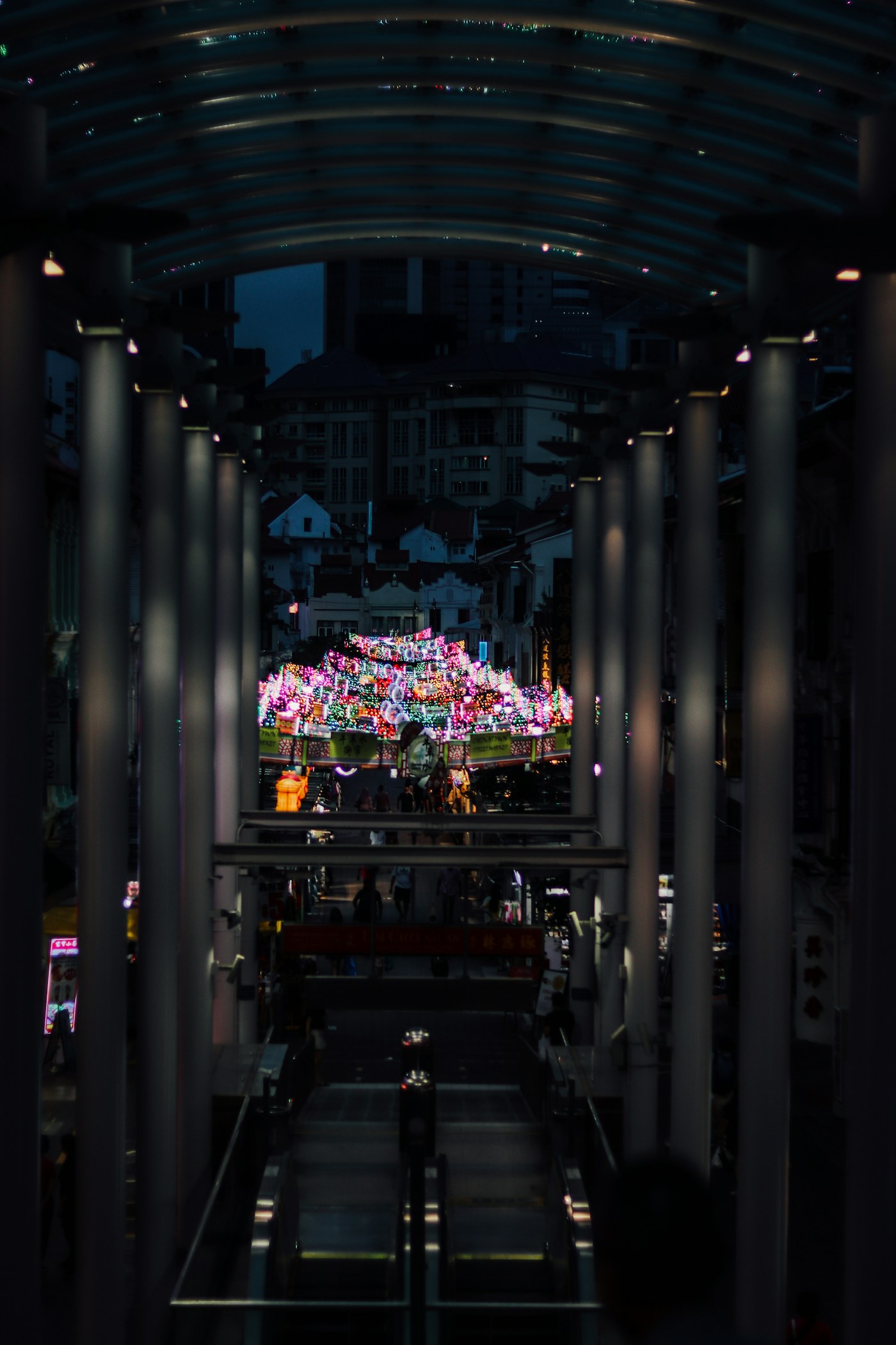 Covered walkway looking onto a Chinatown street at night, a reminder to treat neighbourhood cases with restraint