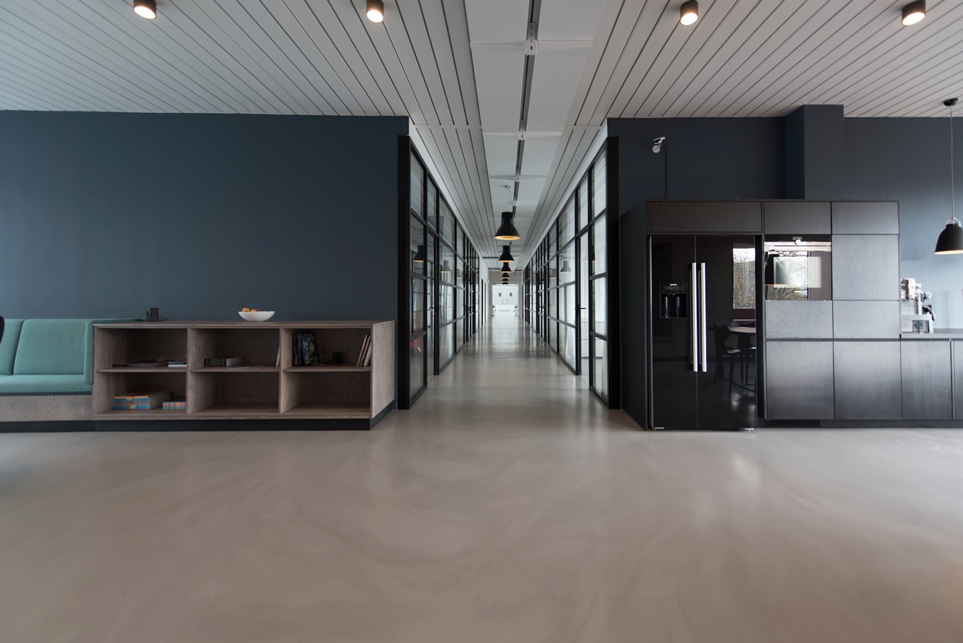 Quiet editorial office with long desks where Listen And Rate drafts reviews
