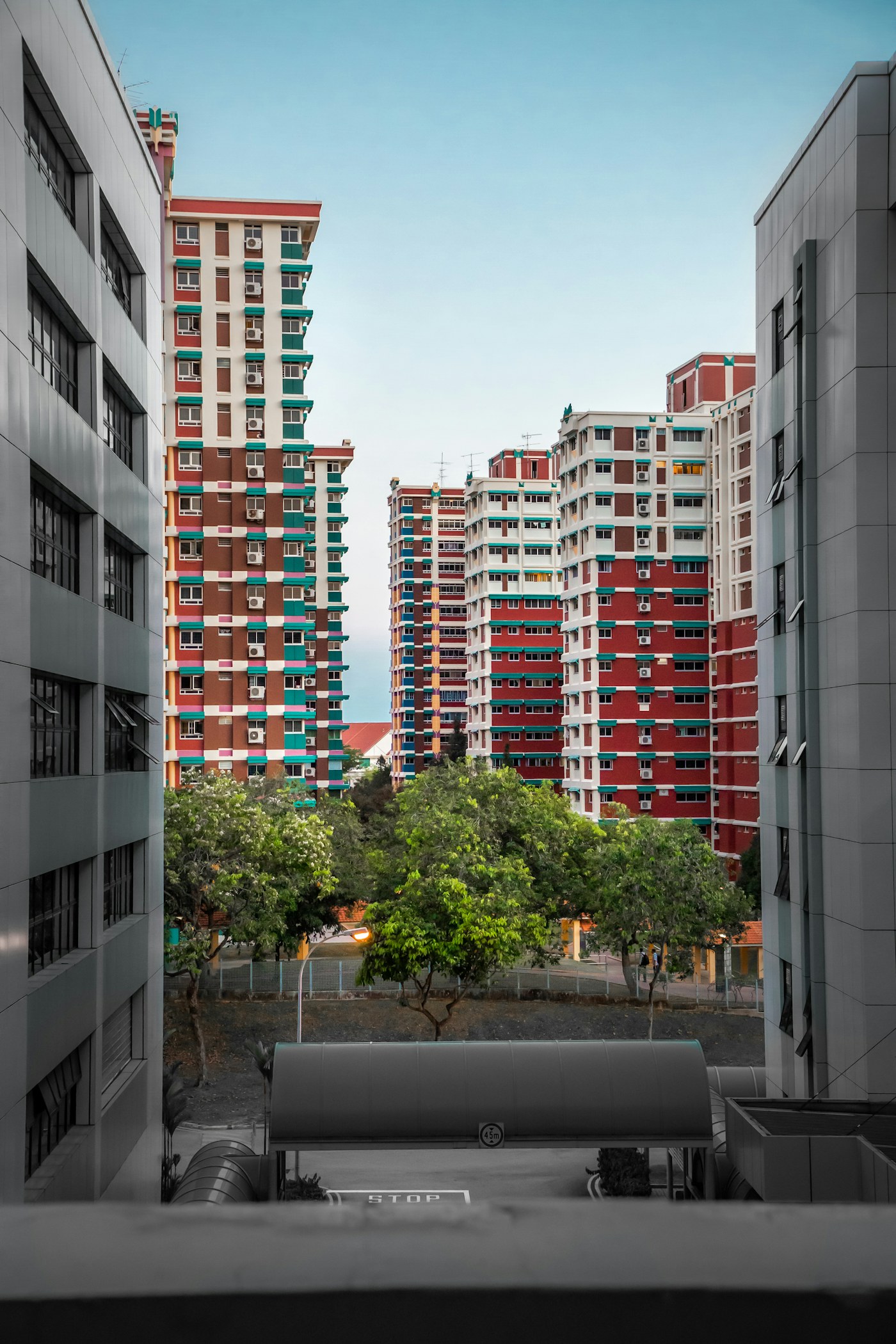 Colourful HDB blocks seen between neighbouring towers, the housing texture of Chin Swee and Outram