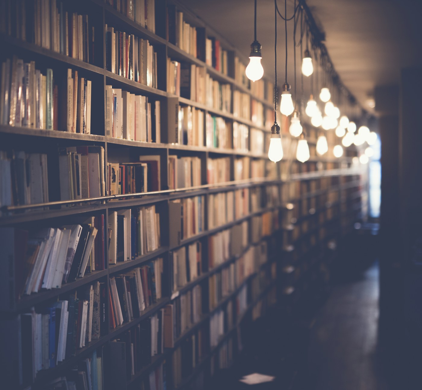 Open books on a table, standing for the archives and reporting we check against the tape