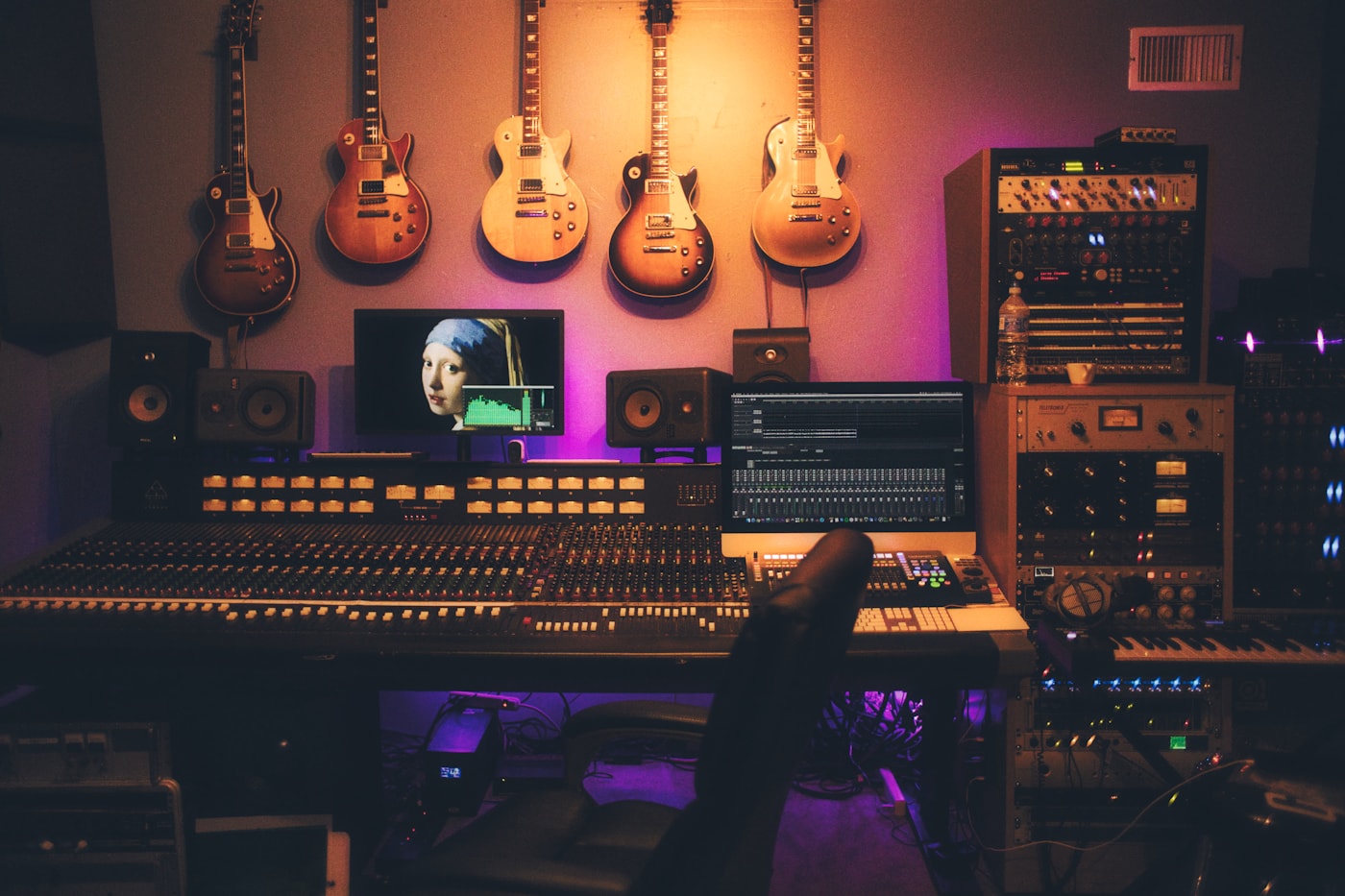 Audio mixing desk and monitors used to judge sound design, ambience, and scoring